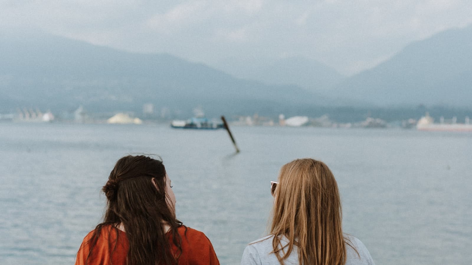 Two people in a warm, supportive conversation outdoors